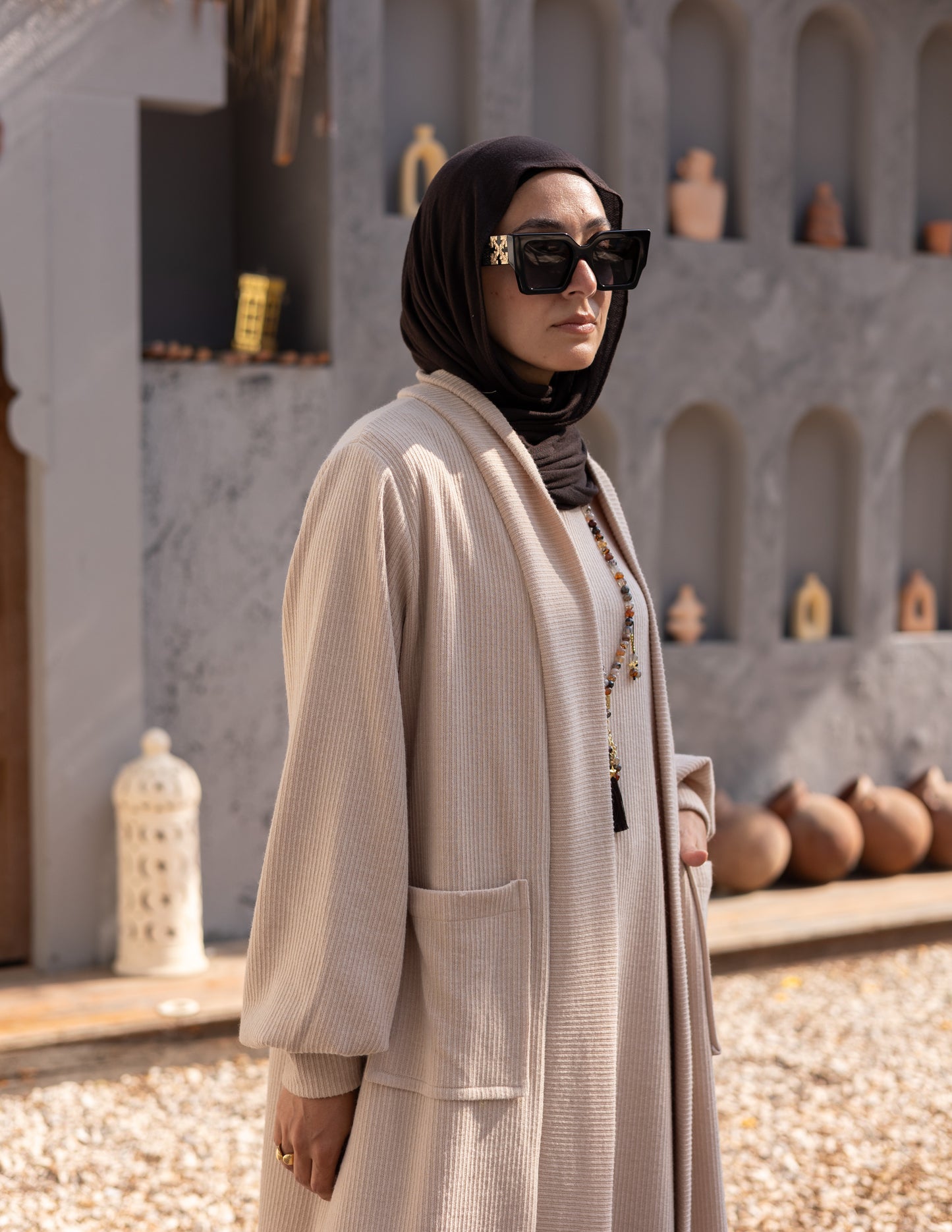 Woolen knitted cut dress in Beige