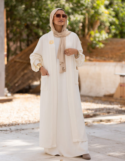 Woolen knitted cut dress in Off white