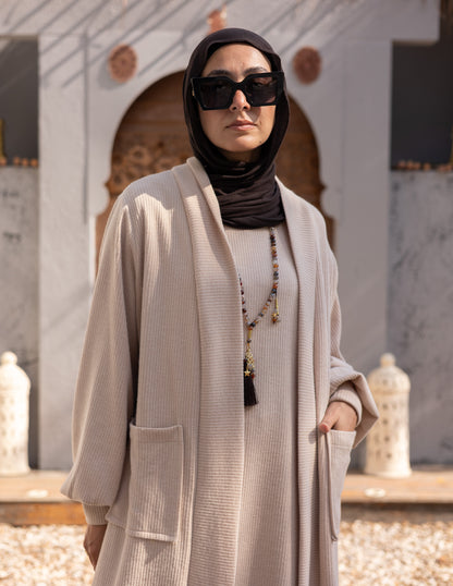 Woolen knitted cut dress in Beige