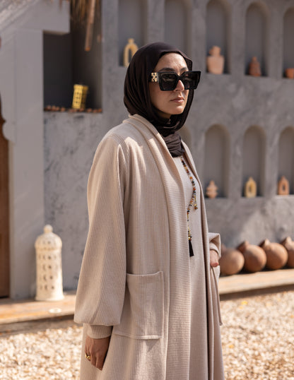 Woolen knitted cut dress in Beige