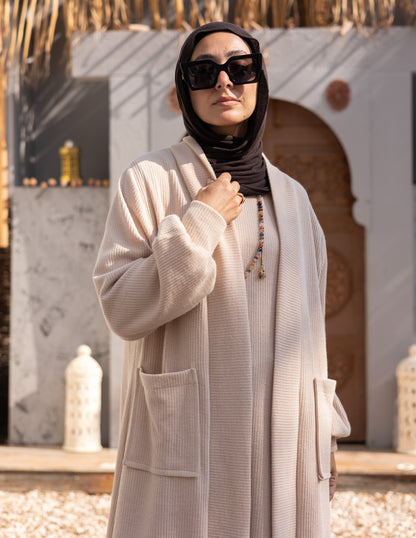 Woolen knitted cut dress in Beige