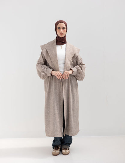 Trendy Lenin cardigan with golden dots in cafe