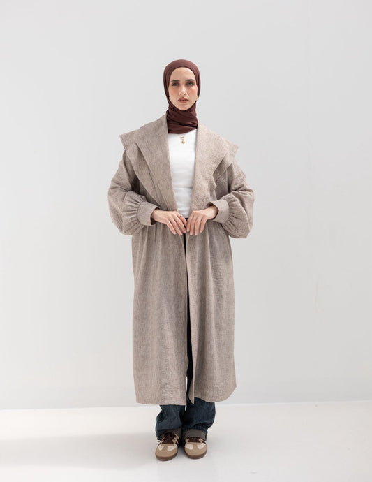 Trendy Lenin cardigan with golden dots in cafe