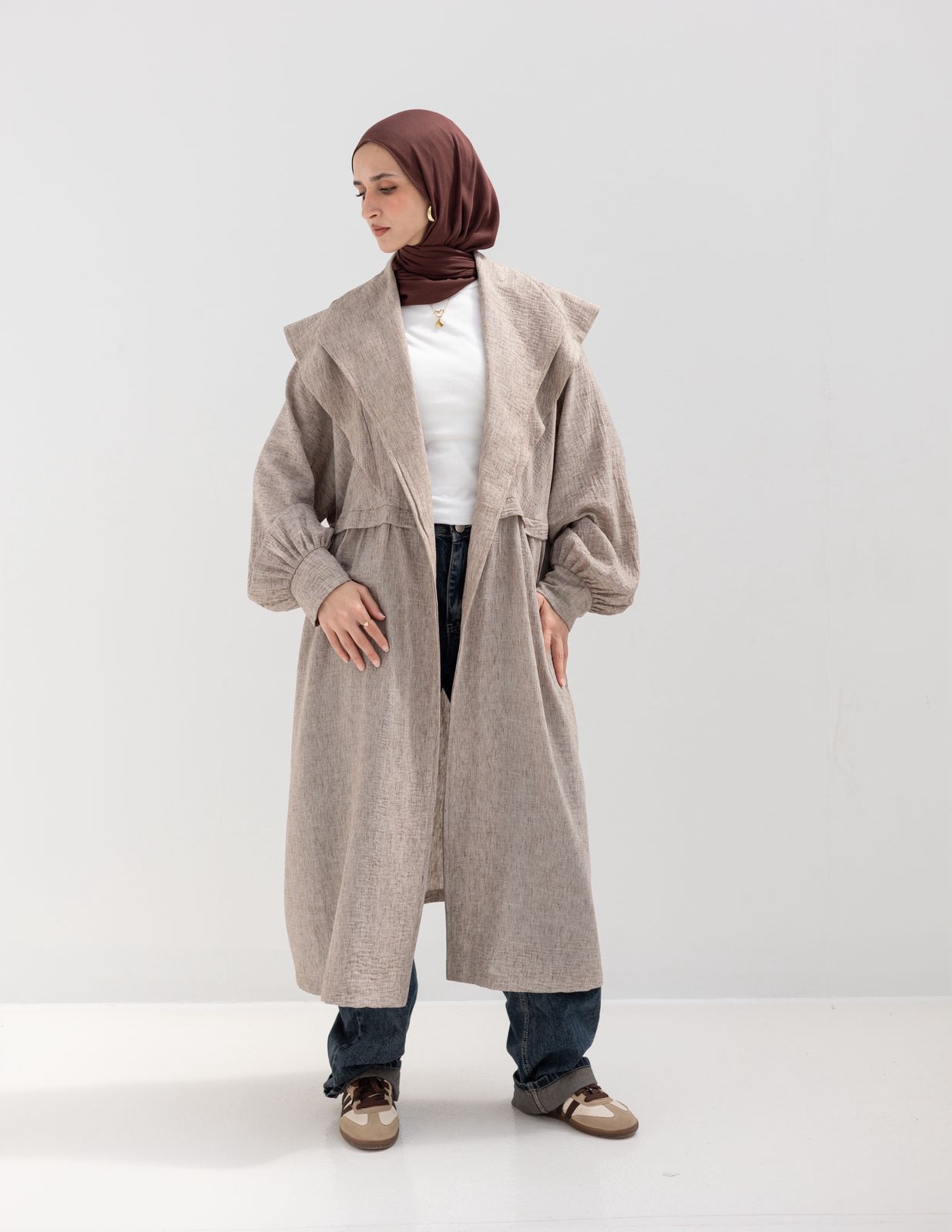 Trendy Lenin cardigan with golden dots in cafe