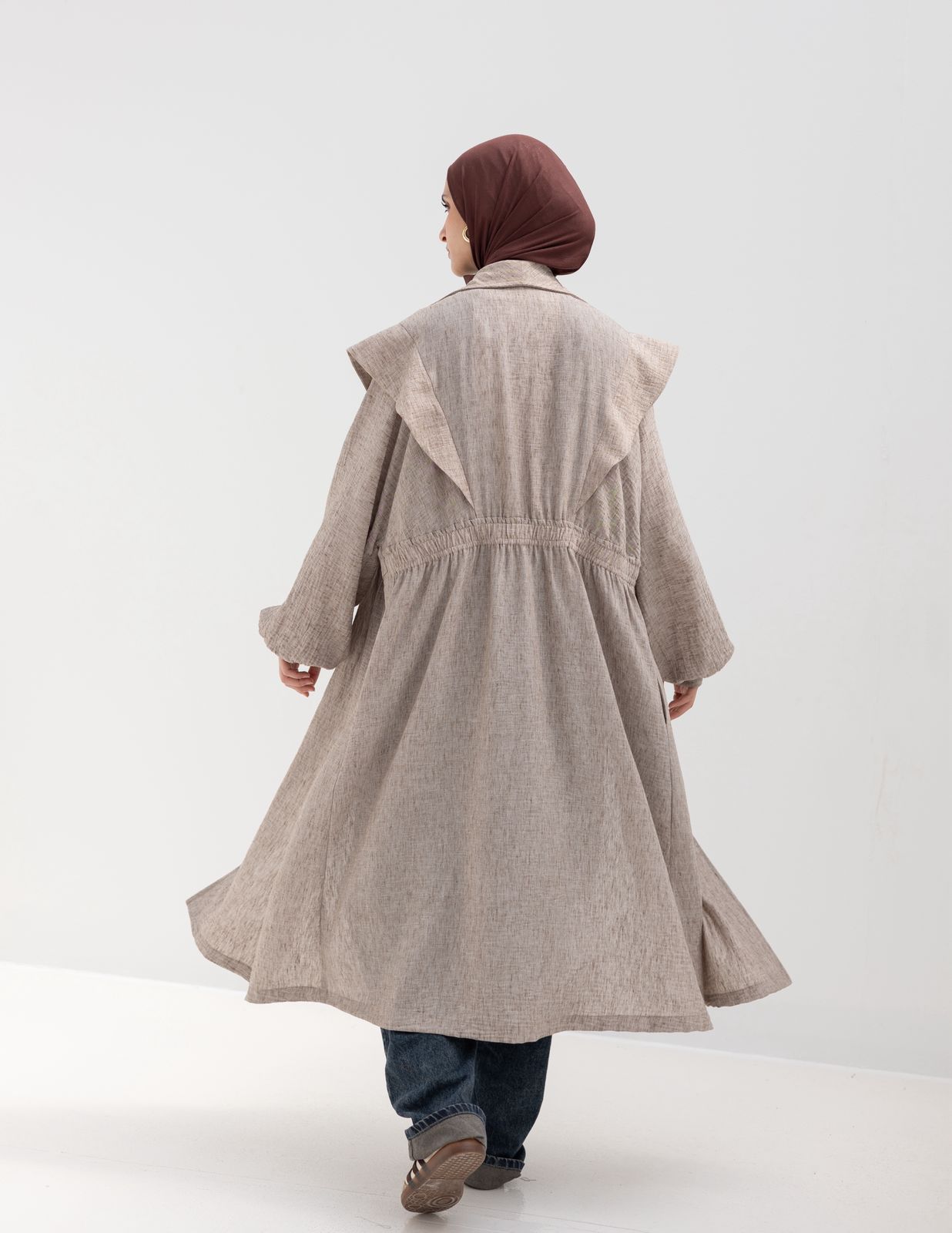 Trendy Lenin cardigan with golden dots in cafe