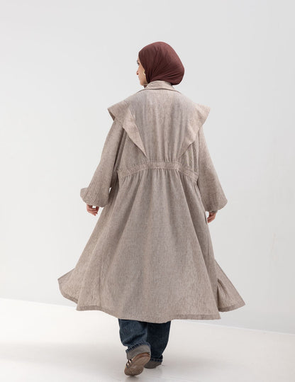 Trendy Lenin cardigan with golden dots in cafe