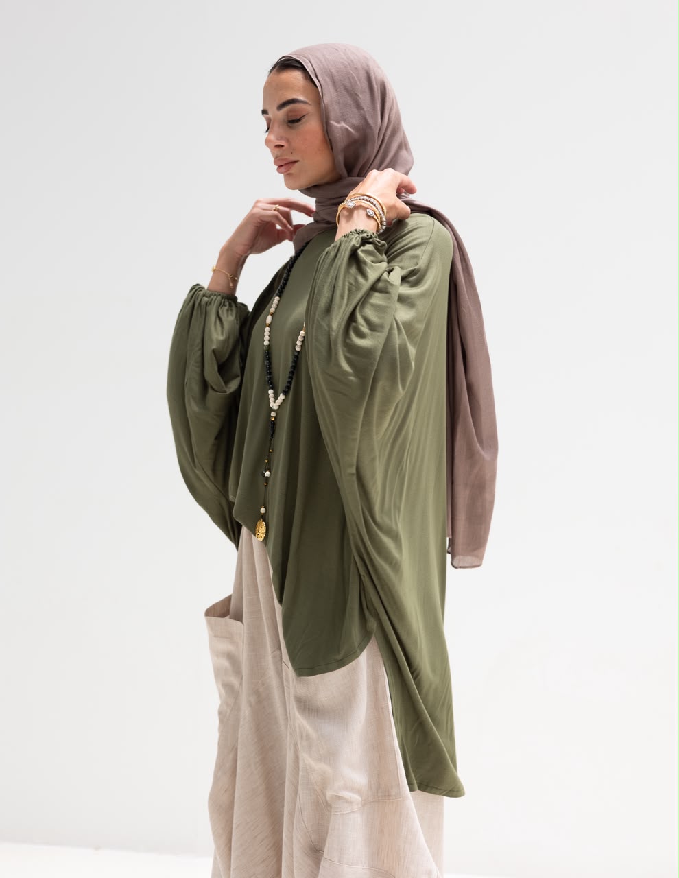 Soft light Lycra high low blouse  in Olive