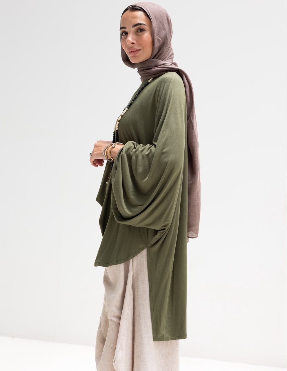 Soft light Lycra high low blouse  in Olive