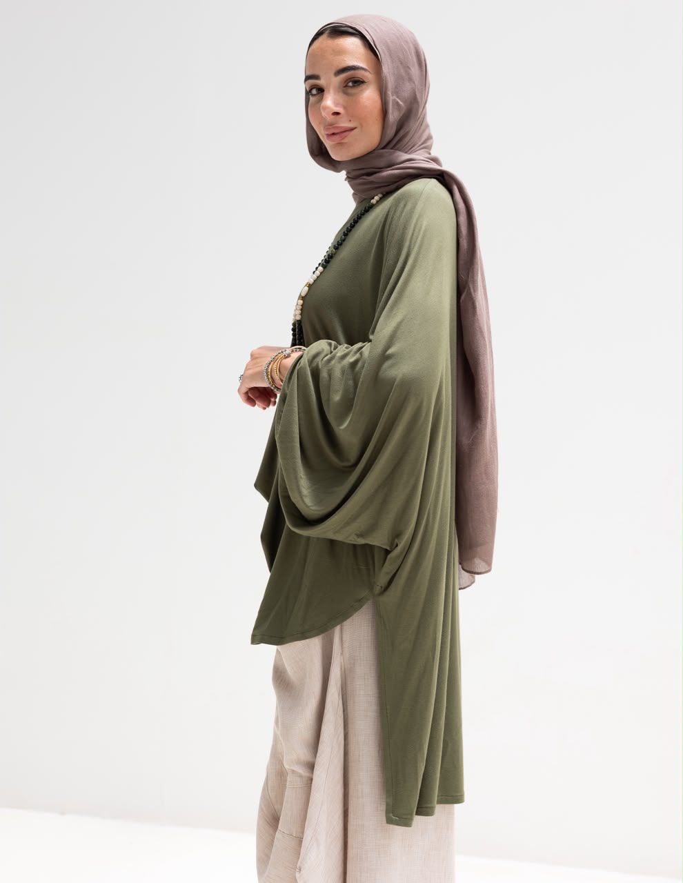 Soft light Lycra high low blouse  in Olive