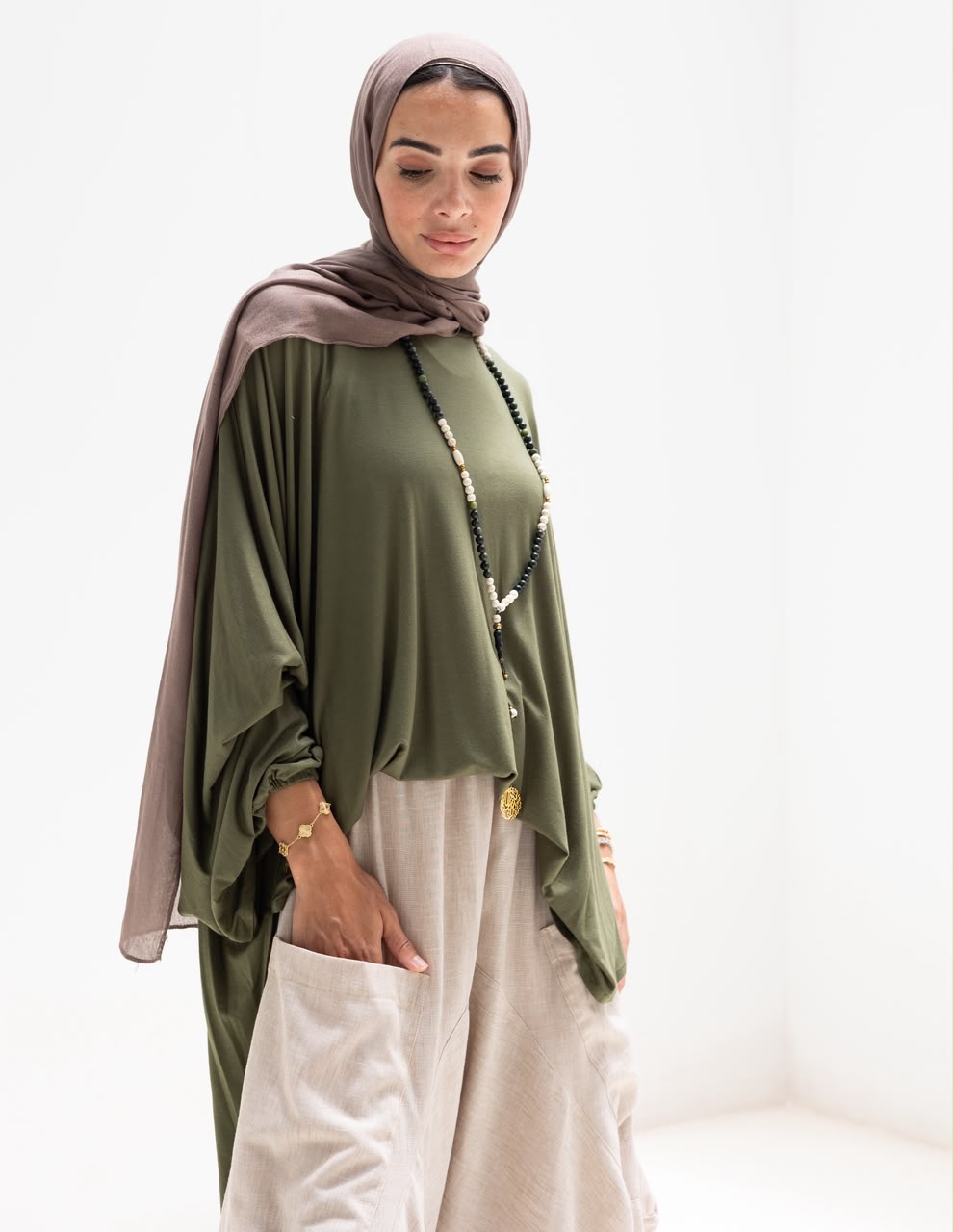 Soft light Lycra high low blouse  in Olive