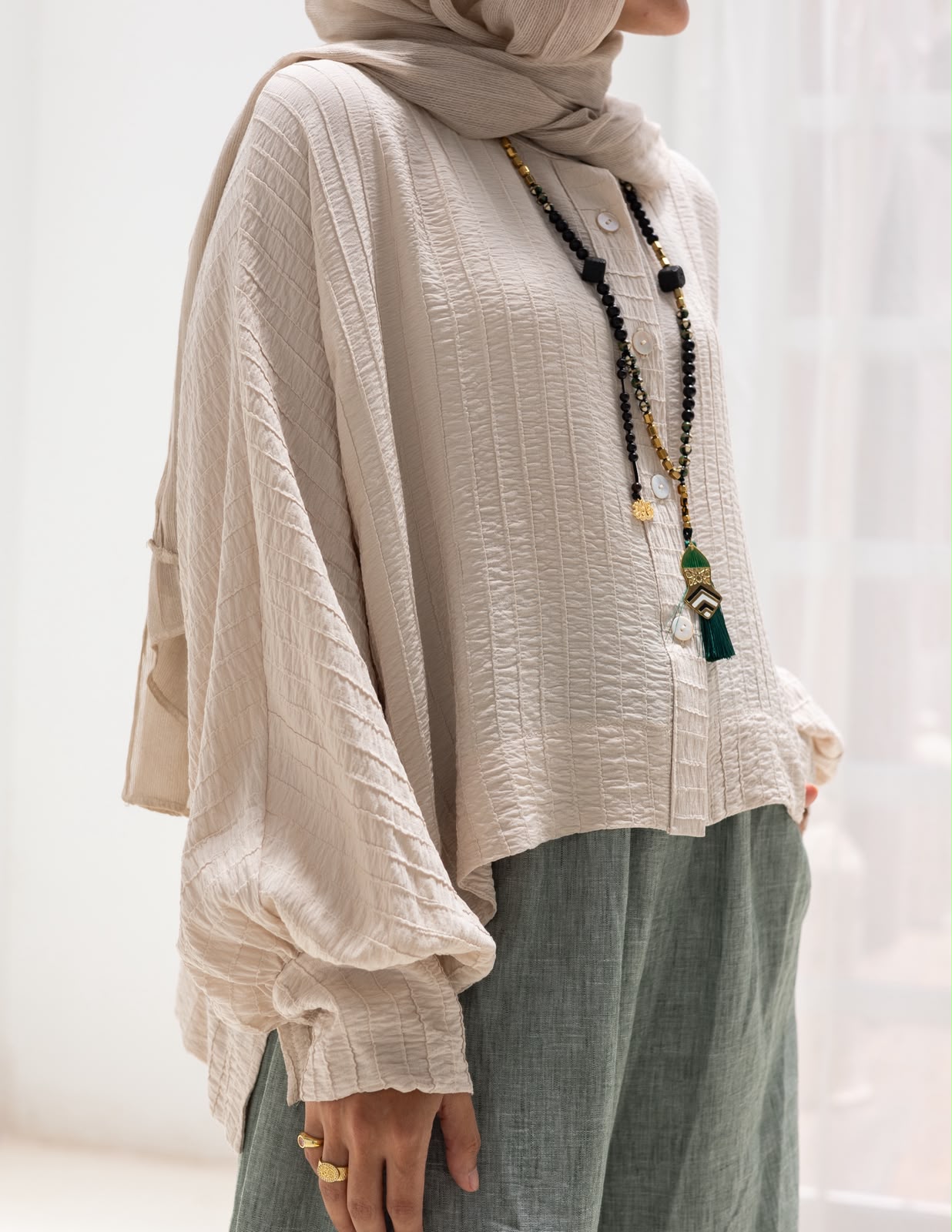Trendy blouse with buttons  in beige