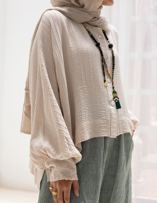 Trendy blouse with buttons  in beige
