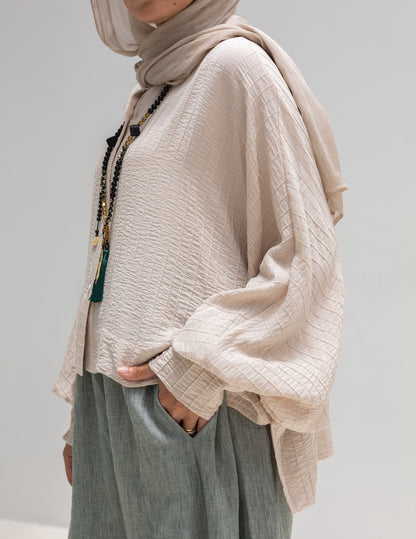 Trendy blouse with buttons  in beige