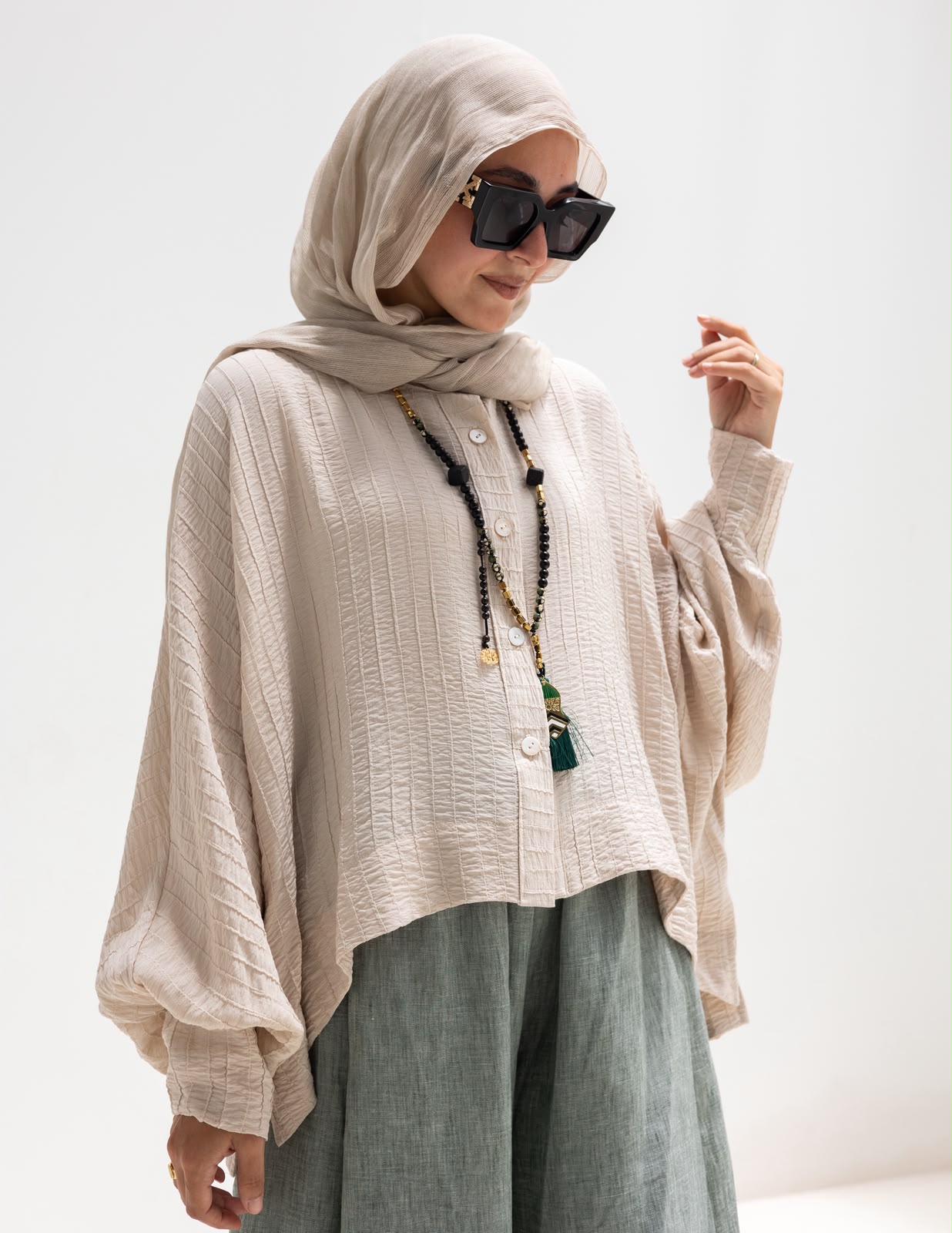 Trendy blouse with buttons  in beige