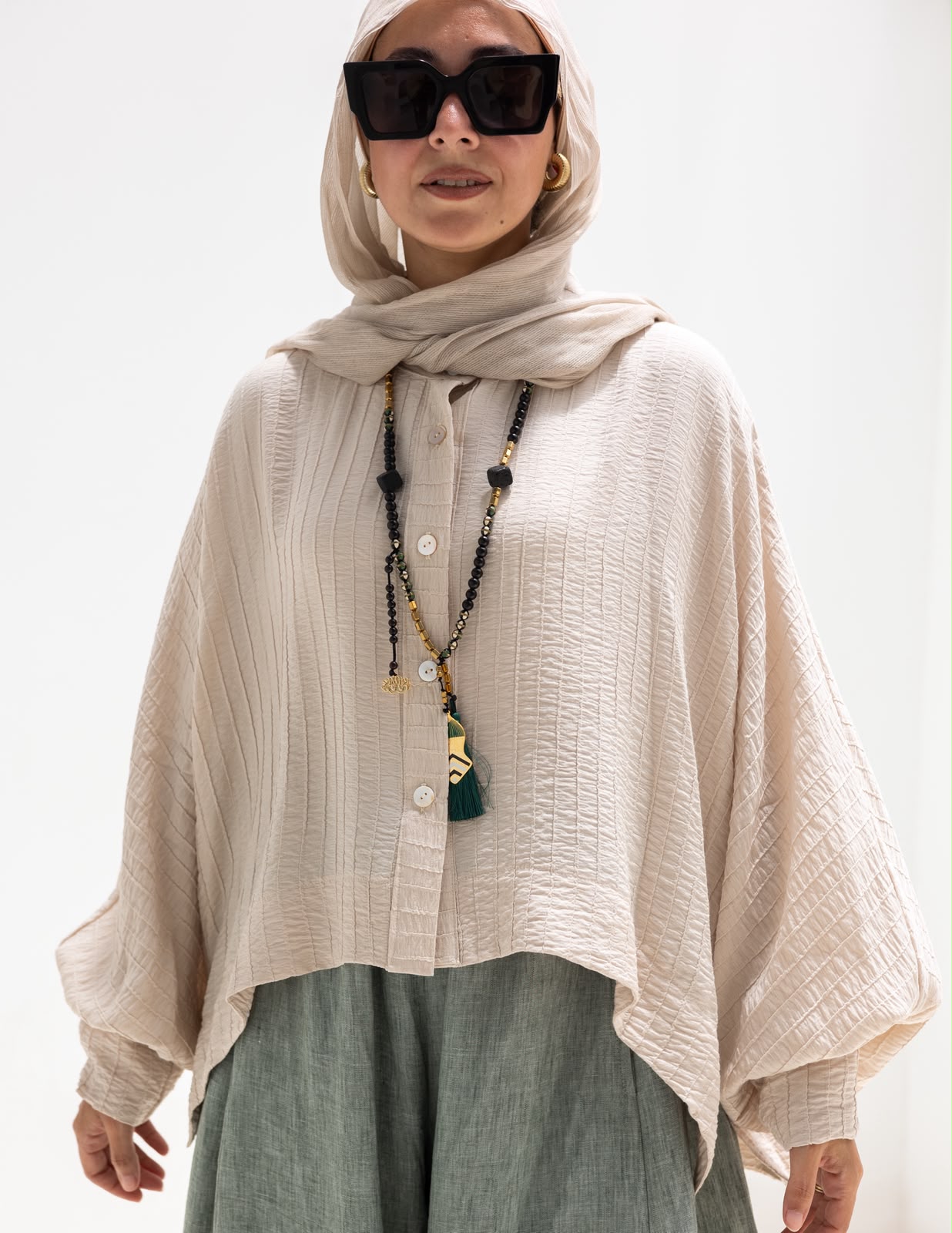 Trendy blouse with buttons  in beige