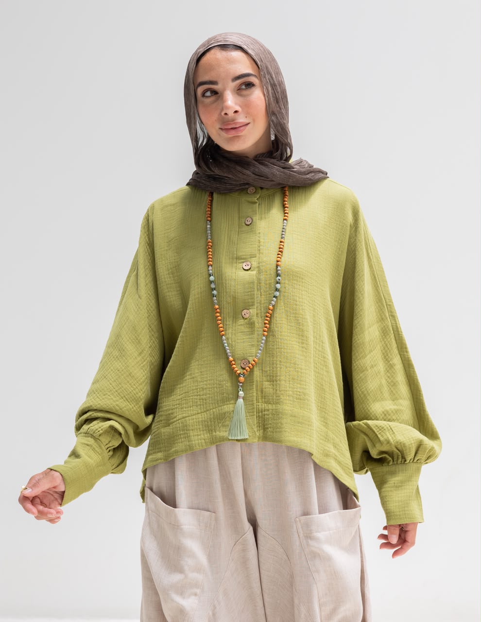 Trendy blouse with buttons  in pistachio