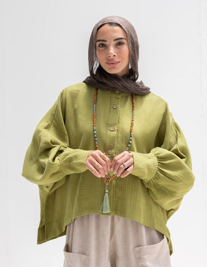 Trendy blouse with buttons  in pistachio