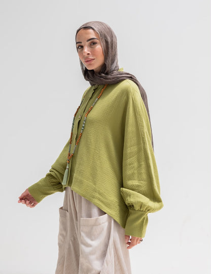 Trendy blouse with buttons  in pistachio